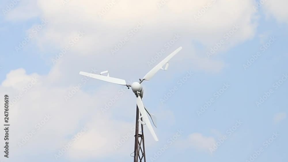 wind power station is spinning on the background of a beautiful sky wind power station is spinning on the background of a beautiful sky