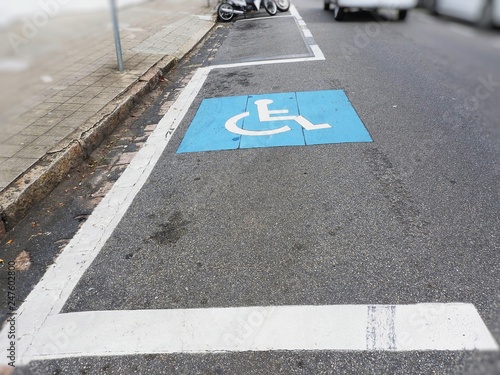 Space reserved for car parking for people with physical disabilities icon designed on the floor for wheelchairs