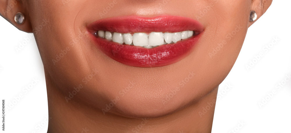 Obraz premium smile of young woman with white teeth and cherry lipstick 