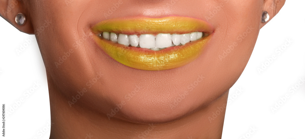 Obraz premium smile of young woman with white teeth and yellow lipstick 
