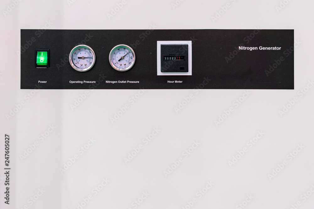 Pressure gauge - hour meter and switch electric power on off install at control panel nitrogen generator for industrial with copy space Pressure gauge - hour meter and switch electric power on off install at control panel nitrogen generator for industrial with copy space