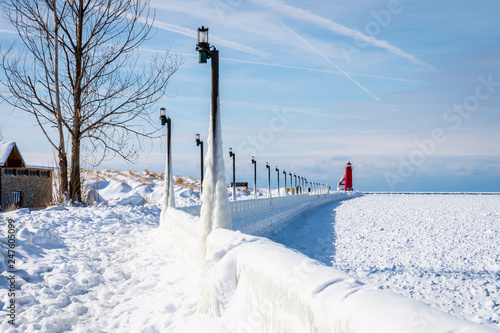 Light poles covered with ice on the pier walkway during the polar vortex in Grand Haven, Michigan. photo