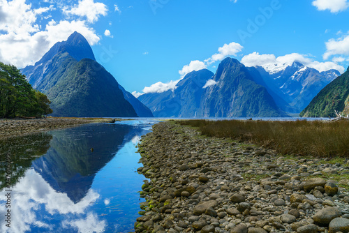 reflections of mountains in the water, milford sound, new zealand 39