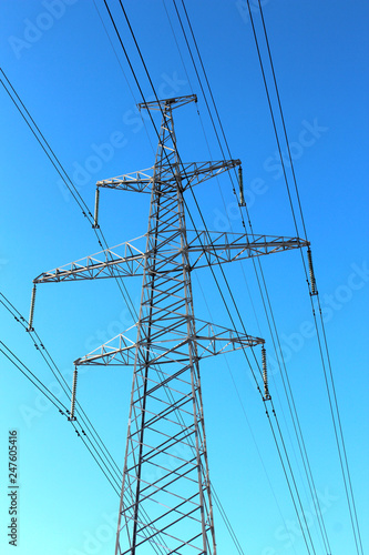 Power transmission tower on background of blue sky