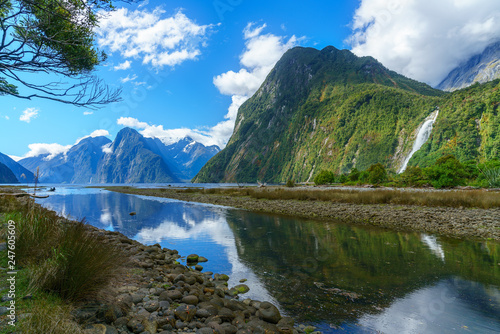 reflections of mountains and a waterfall, milford sound, new zealand 2