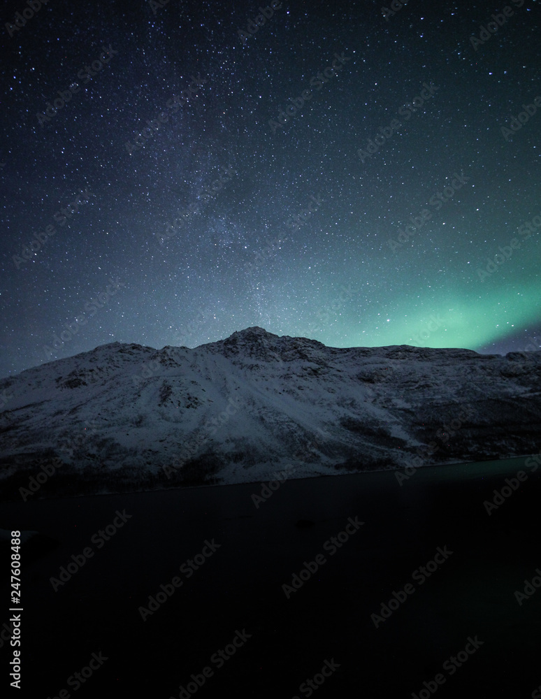 Northern lights over mountain