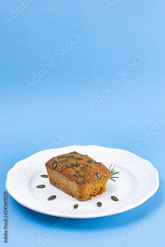 Gluten-Free pumpkin bread with pumpkin seed in white plate. photo