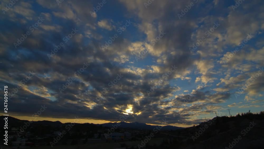 Epic cloudy sunset timelpase on top of small town Epic cloudy sunset timelpase on top of small town