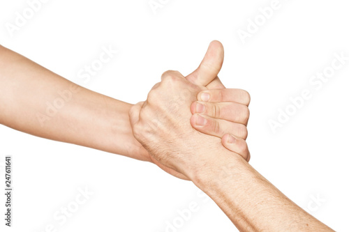 The teenage hand helps the adult's hand to get out of trouble. Concept of help on a white background