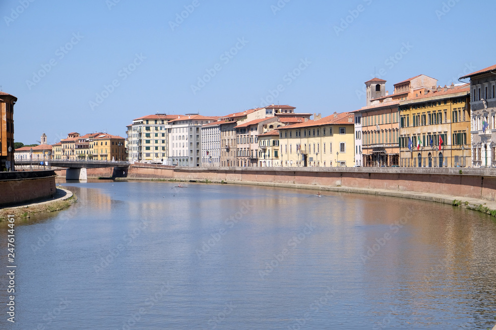 River Arno floating through the medieval city of Pisa in Italy