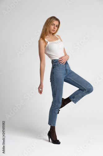 Full length test shooting for fashionable young model wears jeans and shirt