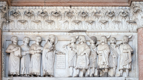 The right portal of the Cathedral of St Martin in Lucca. Lunette dedicated to the life of Saint Regulus, Lucca, Italy.