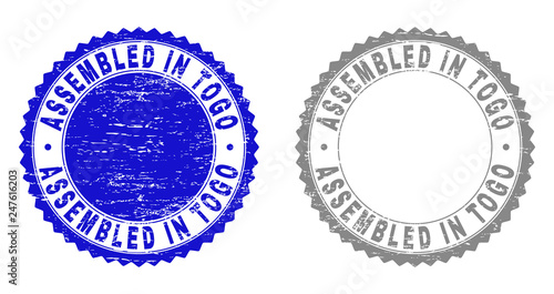 Grunge ASSEMBLED IN TOGO stamp seals isolated on a white background. Rosette seals with grunge texture in blue and grey colors. Vector rubber overlay of ASSEMBLED IN TOGO title inside round rosette.