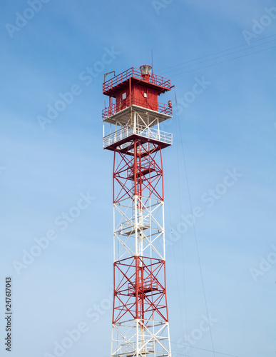 red and white color metal sea navigational lighthouse
