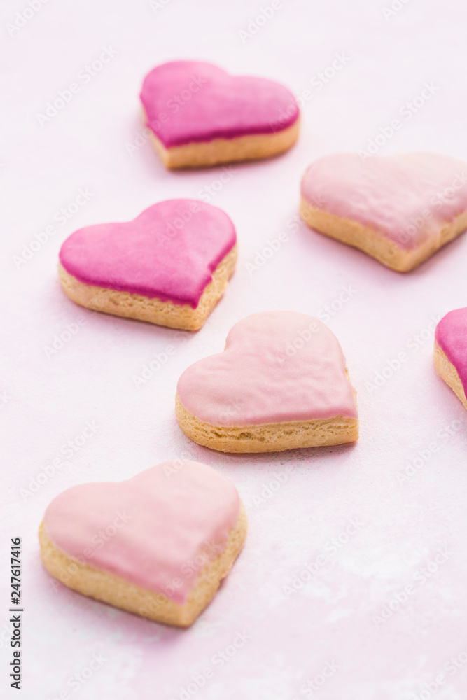 Heart shaped cookies with pink frosting Heart shaped cookies with pink frosting