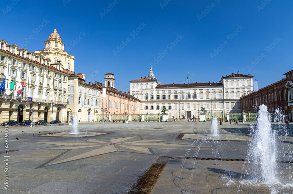 Royal Palace Palazzo Reale and San Lorenzo church building on Castle Square Piazza Castello with fountains and monuments in historical centre of Turin Torino city with clear blue sky, Piedmont, Italy