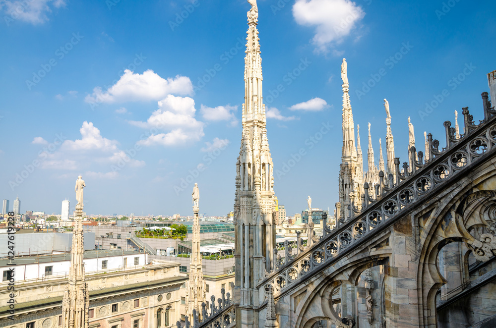 White marble statues on roof of Duomo di Milano Cathedral, Italy
