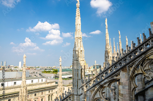 White marble statues on roof of Duomo di Milano Cathedral, Italy © Aliaksandr