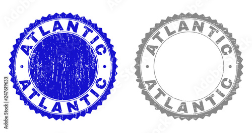 Grunge ATLANTIC stamp seals isolated on a white background. Rosette seals with grunge texture in blue and gray colors. Vector rubber imprint of ATLANTIC title inside round rosette.