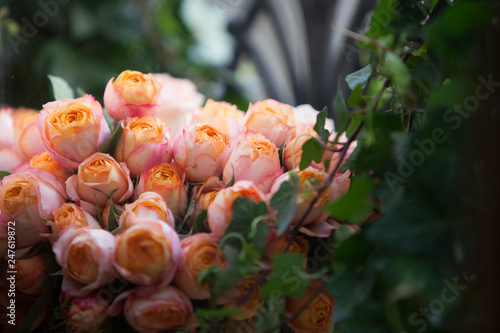 Bouquet of pink and peach colored roses photo