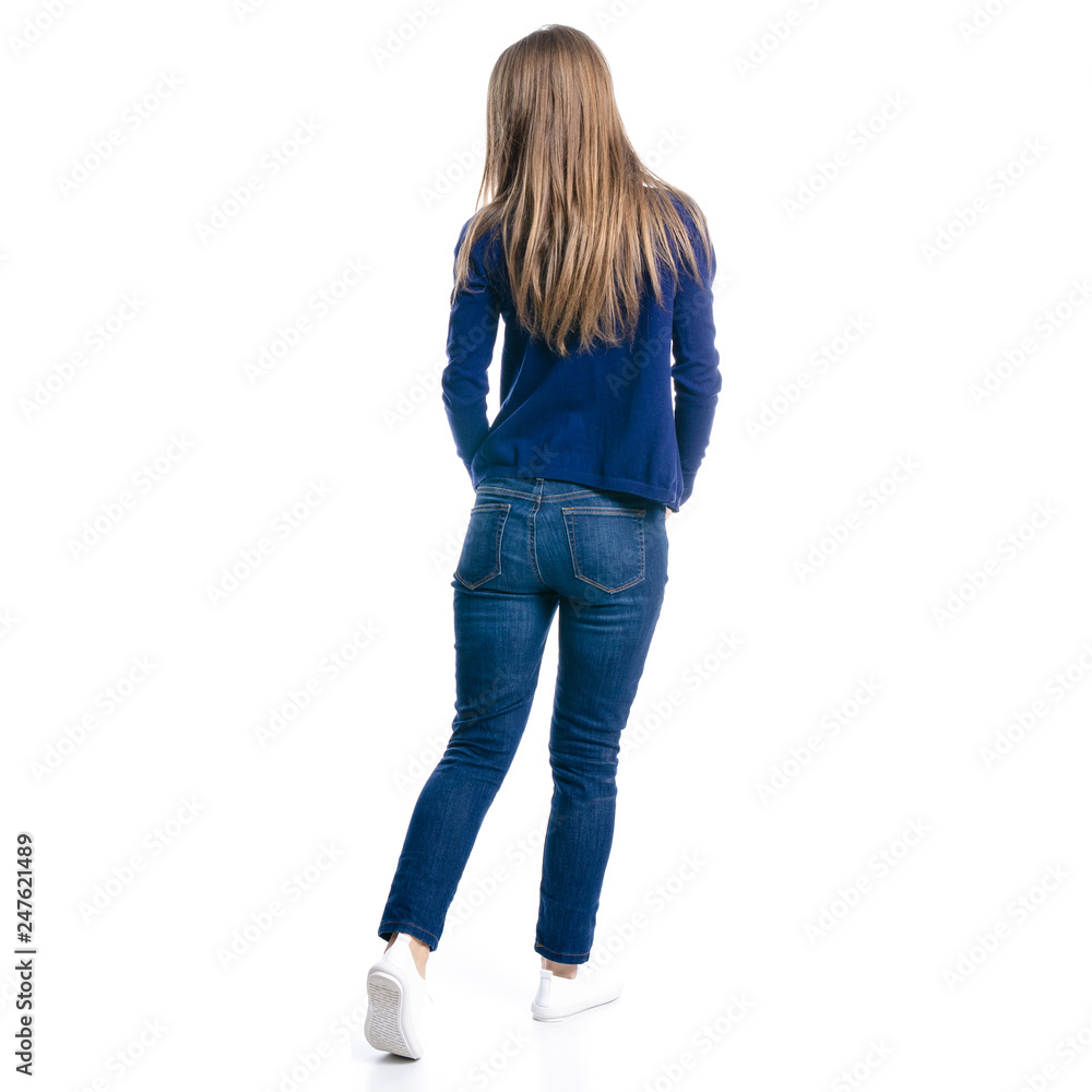 Woman in jeans goes on white background isolation, back view Woman in jeans goes on white background isolation, back view