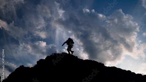 Wallpaper Mural Travel background: silhouette of moving up woman in sun lights. Scenery pictures of autumn alpine national park. Female hipster slowly rising to the wild observation deck. Tired person climbing alone Torontodigital.ca