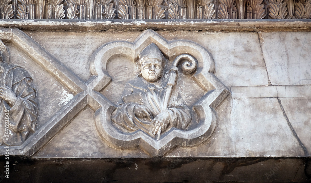 Saint on the portal of the Cathedral of S.Martino in Lucca, Italy