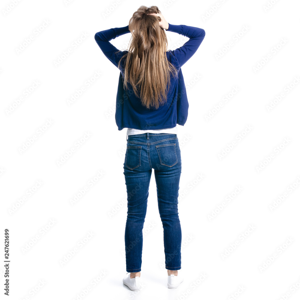 Woman in jeans holding her head on white background isolation, back view Woman in jeans holding her head on white background isolation, back view