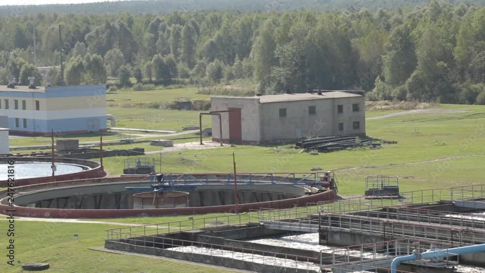 Water treatment tank with waste water with aeration process. A lot of basins for sewerage water aeration and cleaning in process of sewage treatment, biological treatment plant. Water treatment tank with waste water with aeration process. A lot of basins for sewerage water aeration and cleaning in process of sewage treatment, biological treatment plant.