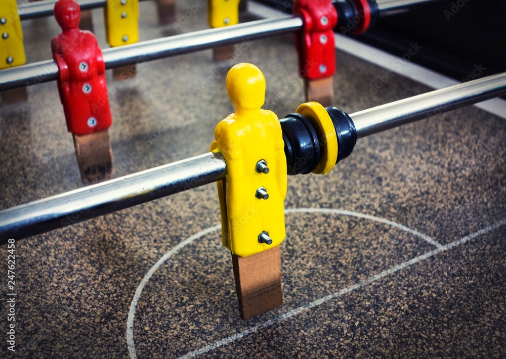 Close up of foosball table soccer figure