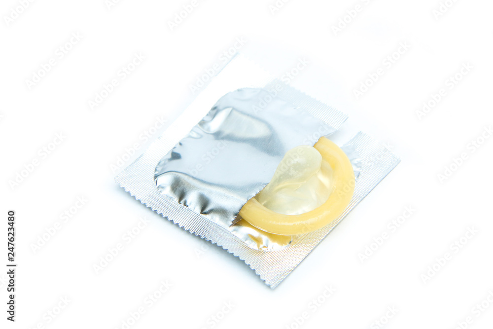 A Picture of an regular condom isolated on a white background. A Picture of an regular condom isolated on a white background.