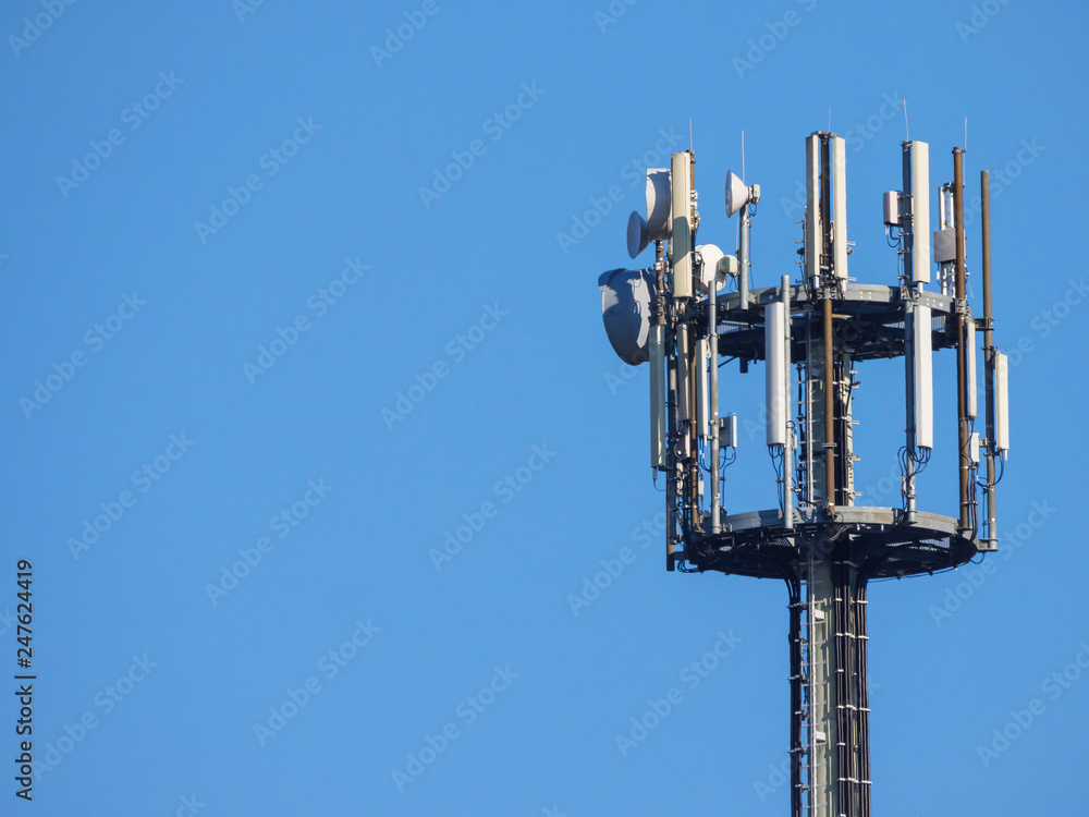 Cellular tower for mobile phone LTE 4G blue sky background