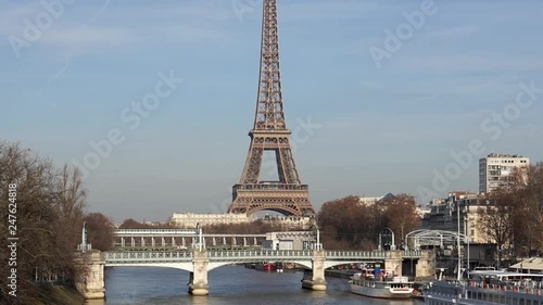 Metro traffic on Pont Bir-Hakeim with Eiffel tower in background and Pont Rouelle in foreground - Paris, France photo