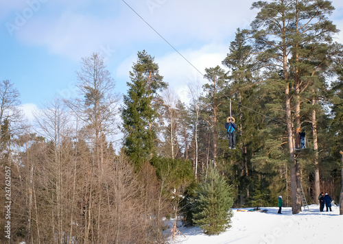 A persone on the zip-line It is extreme winter activity