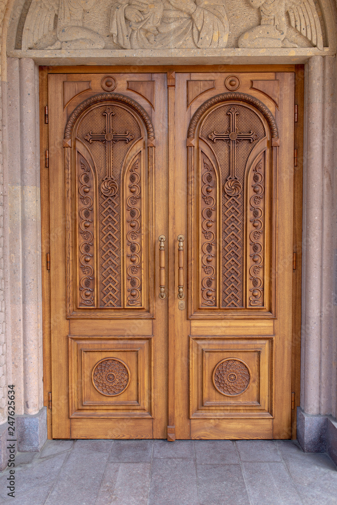 warm wooden door with crosses