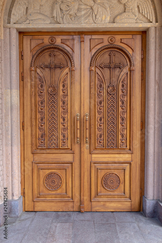 warm wooden door with crosses © rss_maxim