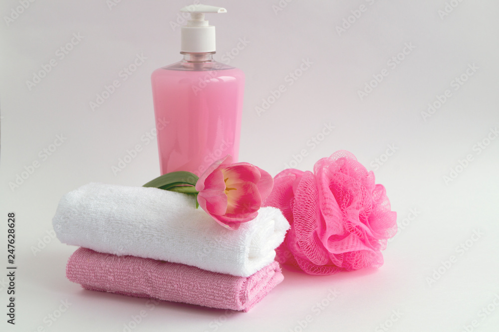 Liquid soap and two towels on a white background. Liquid soap and two towels on a white background.