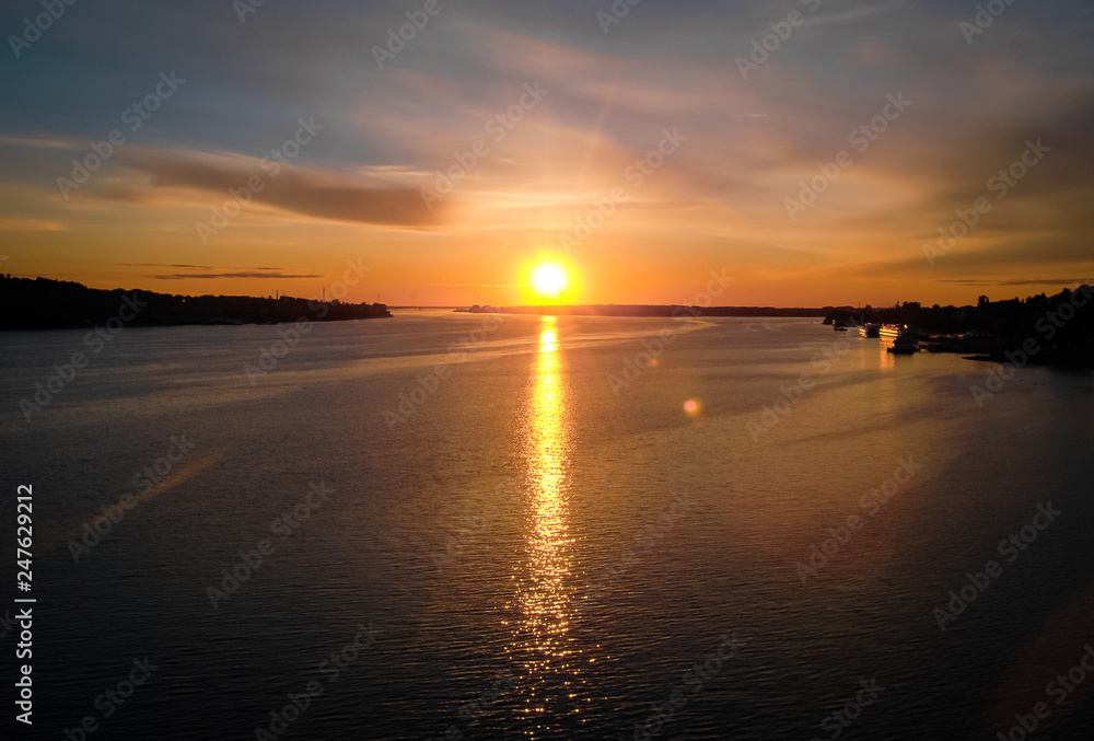 Beautiful sunset. Huge river Volga, town Kostroma, Russia