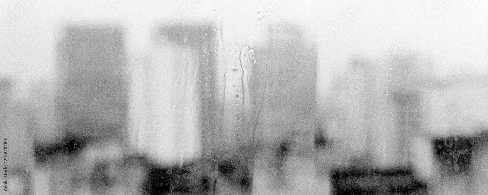 View of Sao Paulo city, Brazil, from downtown through the window of a building. Drizzle background. 2018