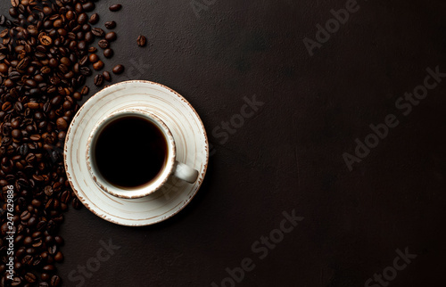 Coffee and beans on the old kitchen table. Top view with copyspace for your text.