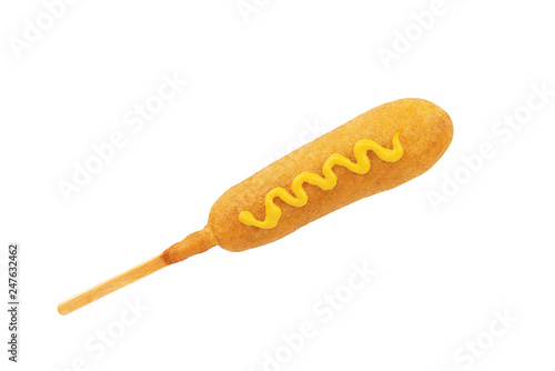 Corn dog with mustard line on top, isolated on a white background.