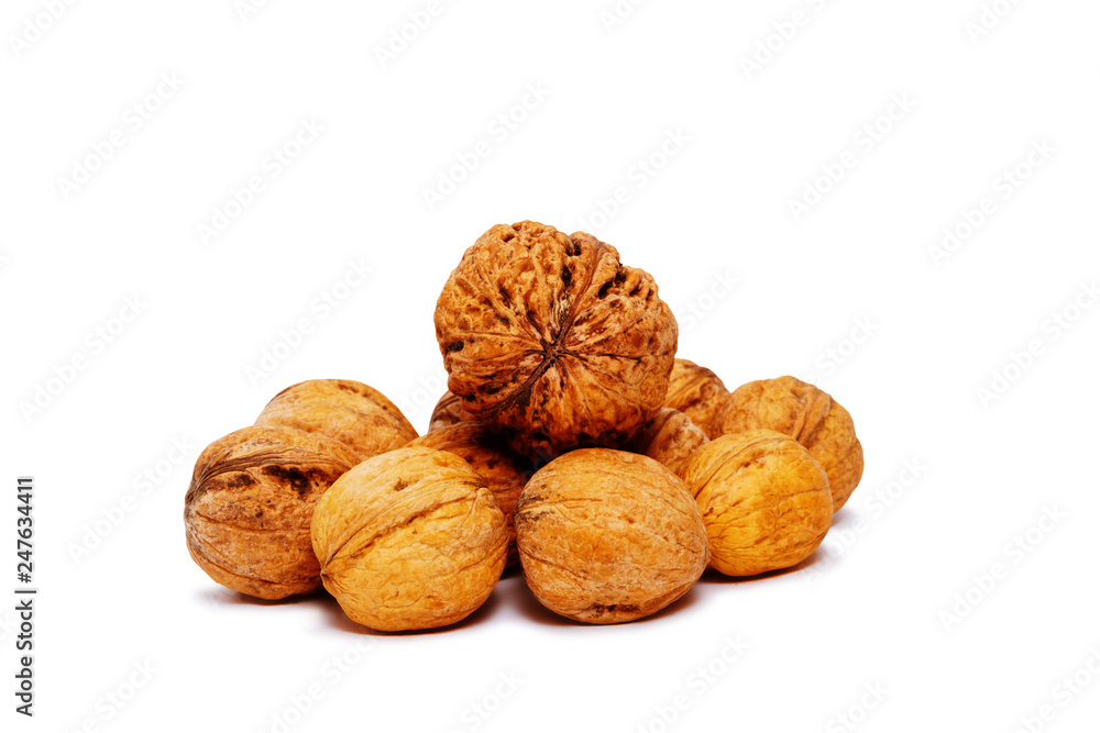 heap of walnuts isolated on a white background heap of walnuts isolated on a white background