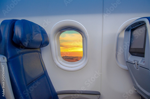 View from Airplane window seat of sunset