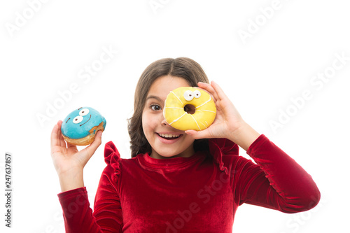 Girl hold sweet donut white background. Child hungry for sweet donut. Sugar levels and healthy nutrition. Nutritionist advice. Sweet obsession. Happy childhood and sweet treats. Breaking diet concept