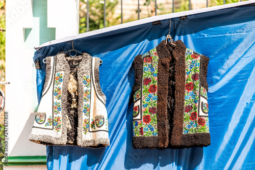 Kyiv, Ukraine Andriyivskyy Uzviz Descent with vendors selling souvenirs vest wool jacket traditional costume in market stall culture clothes on display photo