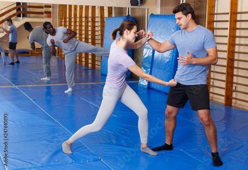 People practicing self defense techniques