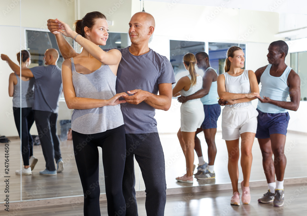 Fototapeta premium Adult people dancing samba in pairs
