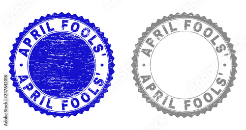Grunge APRIL FOOLS' stamp seals isolated on a white background. Rosette seals with grunge texture in blue and gray colors. Vector rubber imprint of APRIL FOOLS' label inside round rosette.