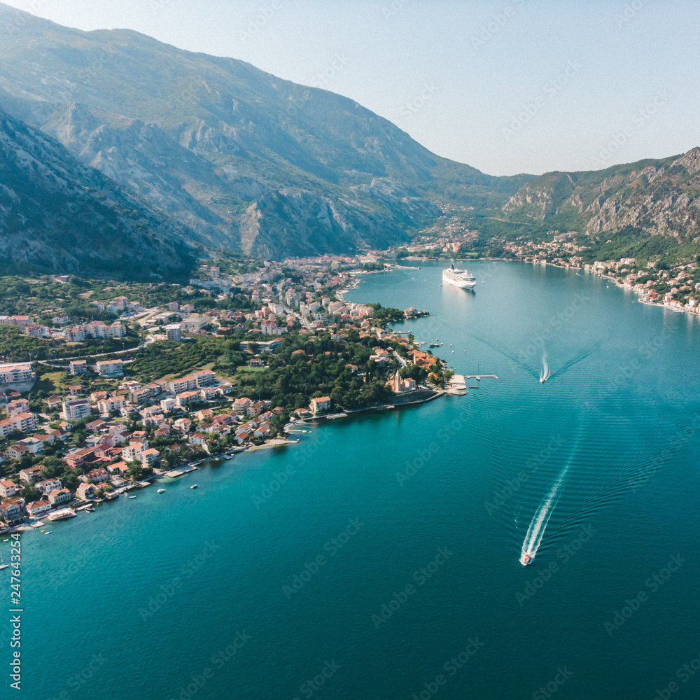 summer time. aerial view of sea bay with boats and cruise liner