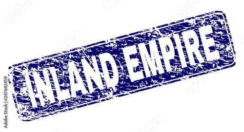 INLAND EMPIRE stamp seal print with distress texture. Seal shape is a rounded rectangle with frame. Blue vector rubber print of INLAND EMPIRE label with dust texture.